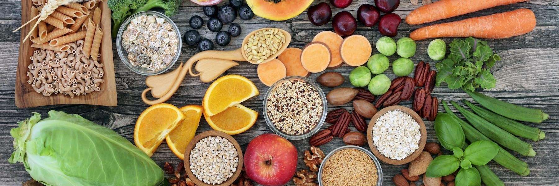 An assortment of fruits, nuts, grains, and vegetables