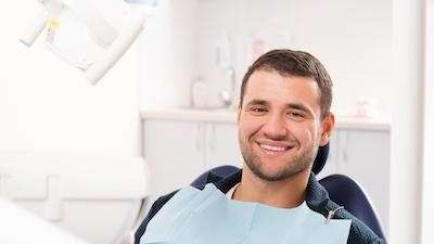 A smiling man in the dental exam chair | Dentist Greeley CO
