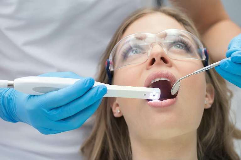 A woman getting a cosmetic dental procedure done in Greeley